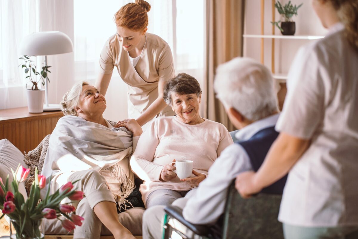 Group of senior friends with a caregiver