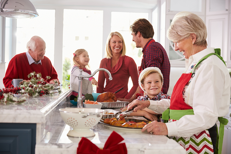 Senior woman baking with her loved ones during the holiday season