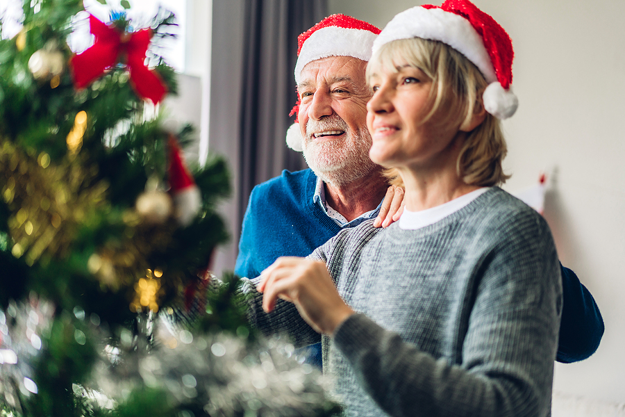 Senior couple decorating for Christmas