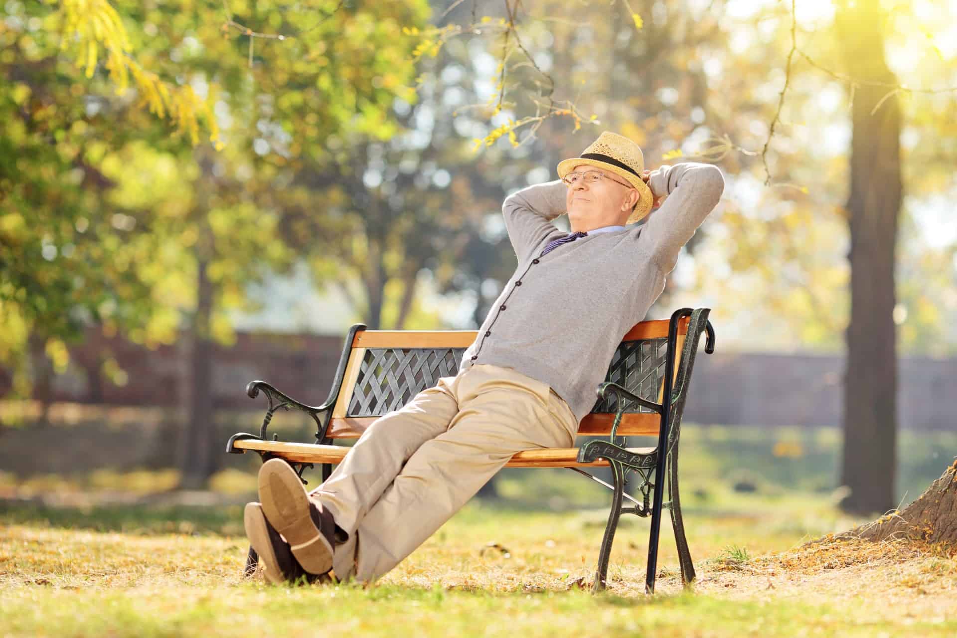 Happy senior man relaxing at a park.