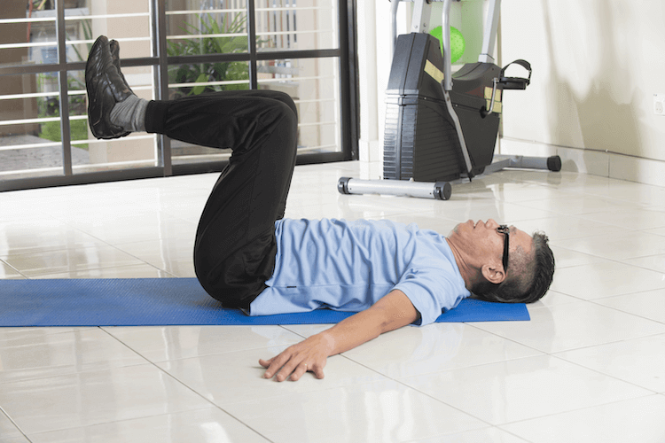 Senior man performing an exercise for hip pain.