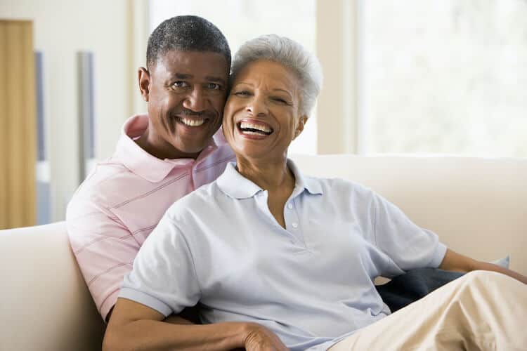 Happy senior couple in their senior living apartment.