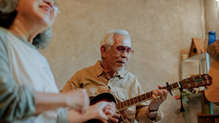 A group of old Asian friends starting a musical session together at home on weekend.