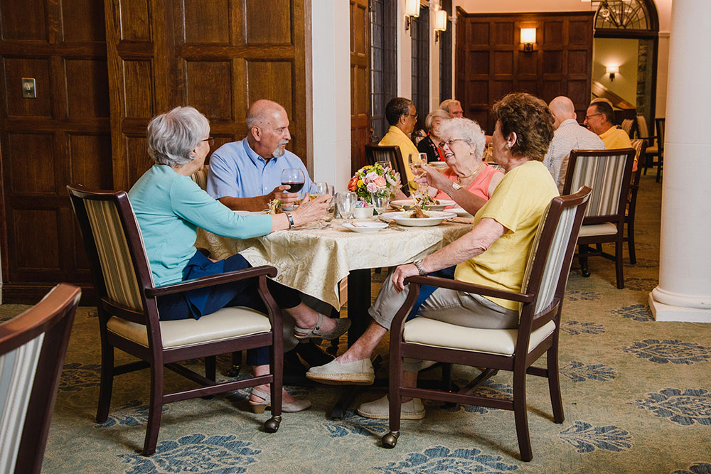 seniors sitting together at a dining table