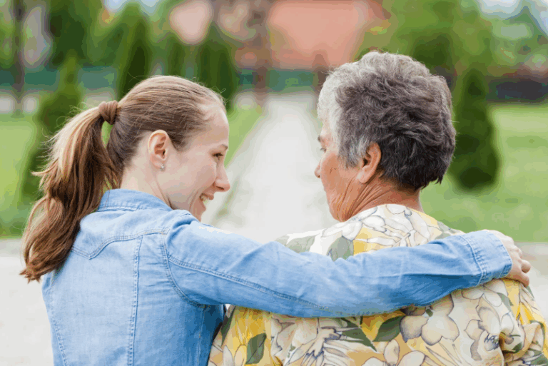 senior mother and daughter walking outside