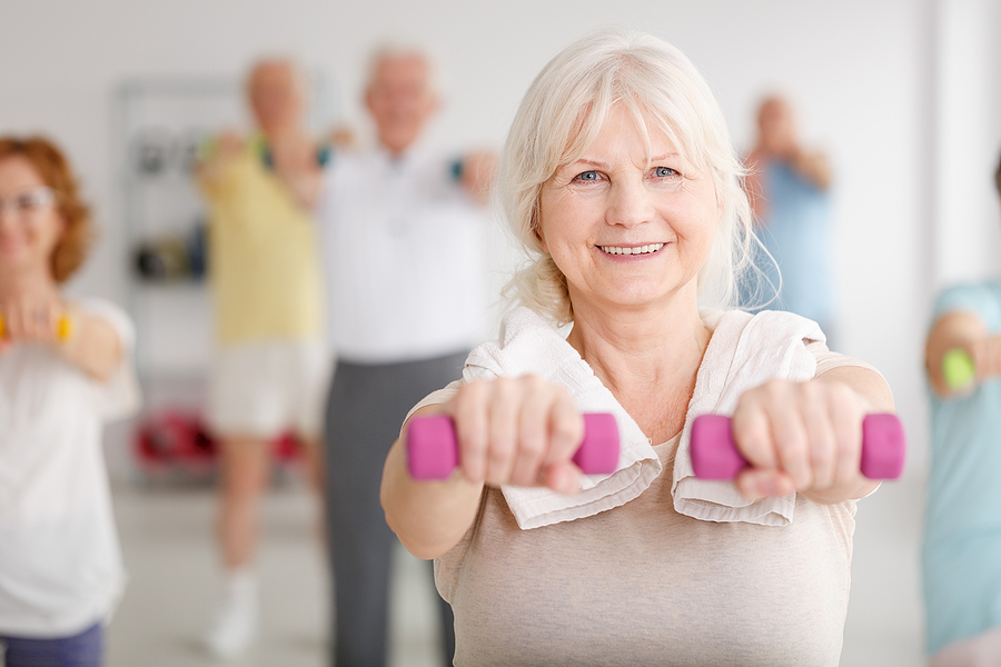 Older woman exercising in the gym