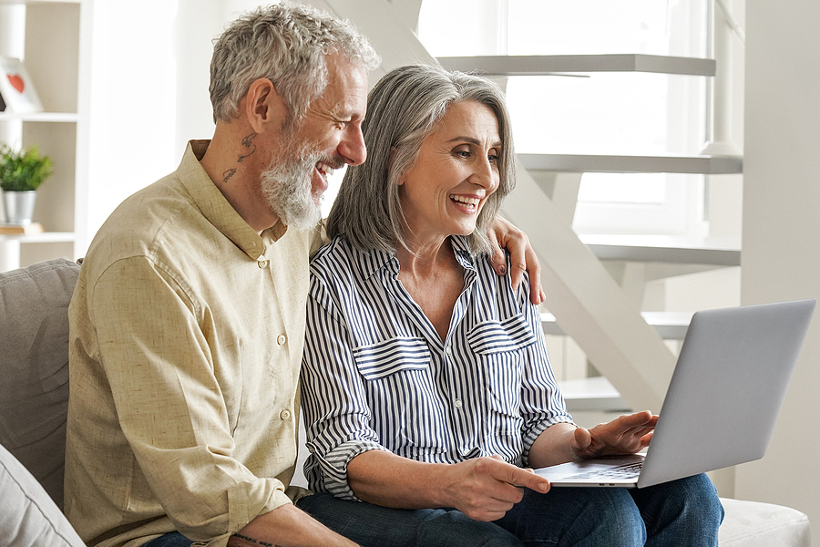 Older adult couple looking at senior living options