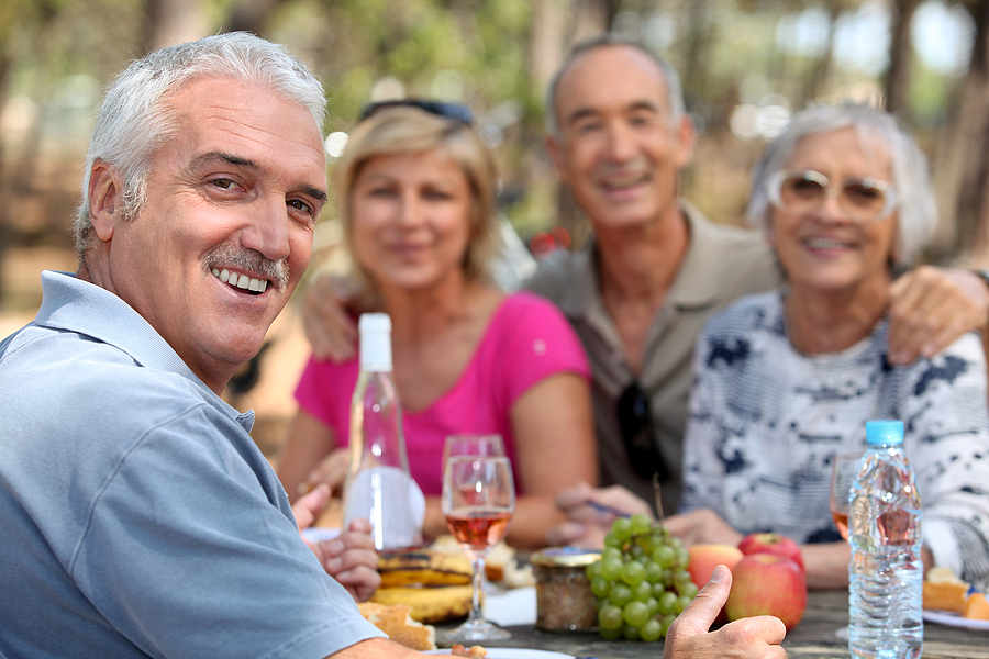 Older adults enjoying lunch outdoors in Maplewood, NJ