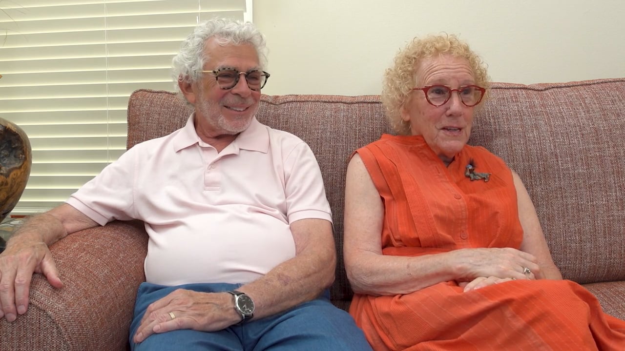 two seniors sitting on a couch